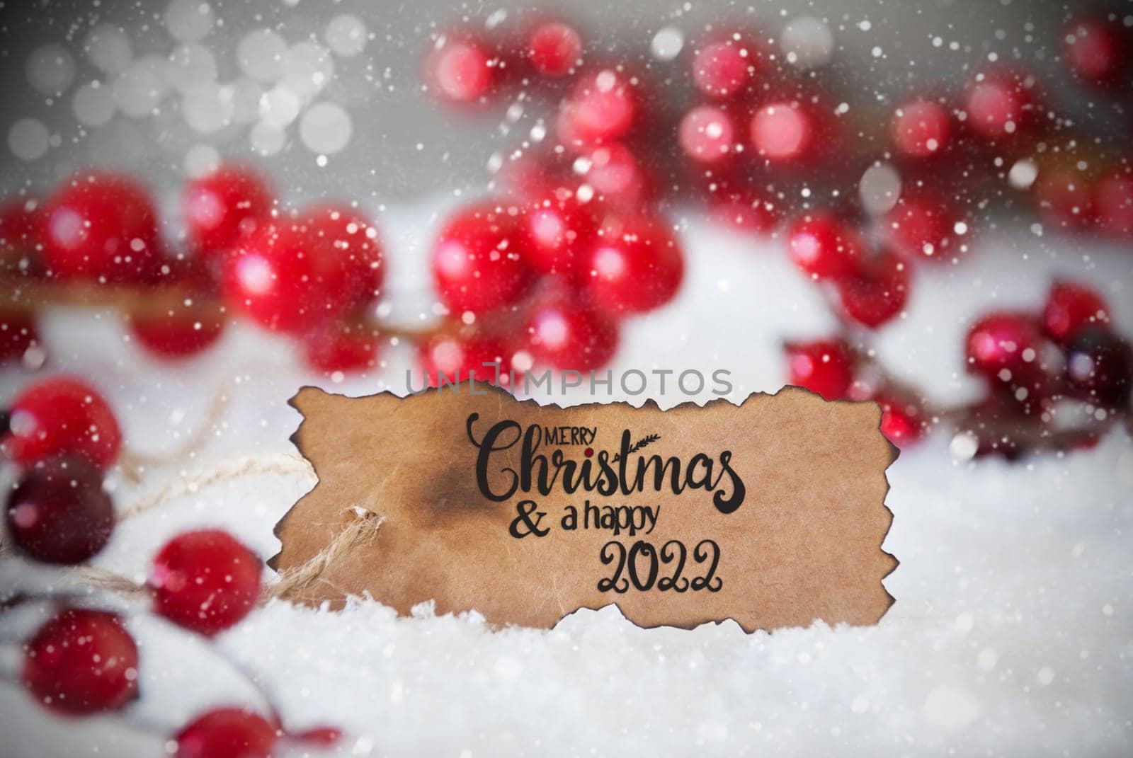 Burnt Label With English Calligraphy Merry Christmas And A Happy 2022. Red Christmas Decoration With Snow And Snowflakes