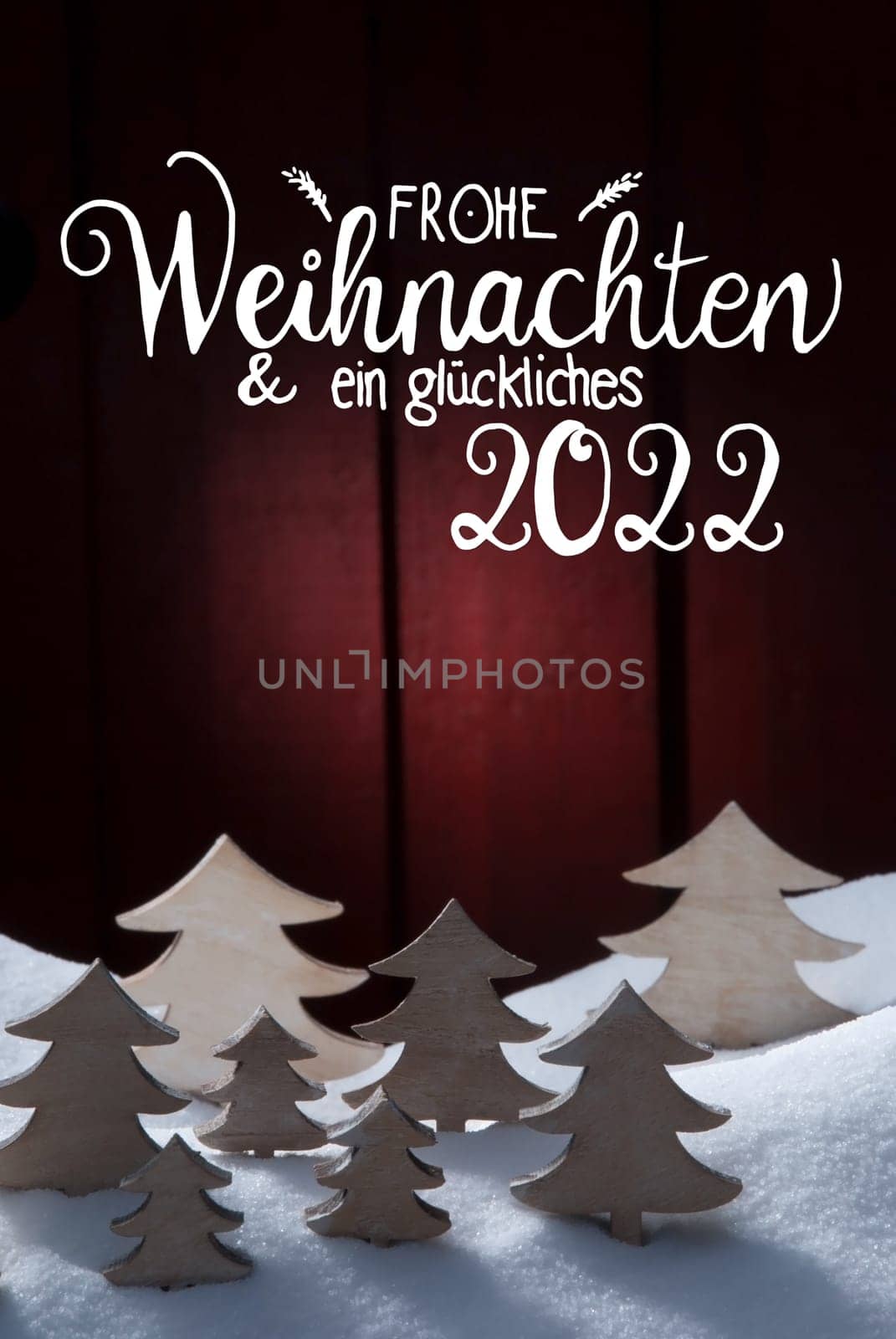 German Calligraphy Frohe Weihnachten Und Ein Glueckliches 2022 Means Merry Christmas And Happy 2022. White Wooden Tree On Snow WIth Red Background