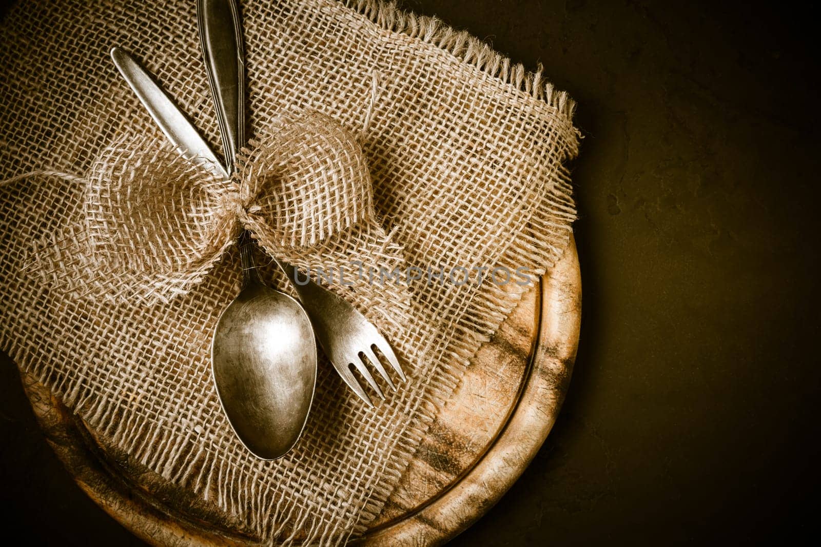 Vintage tableware, cutlery with wooden cutting board with retro effect