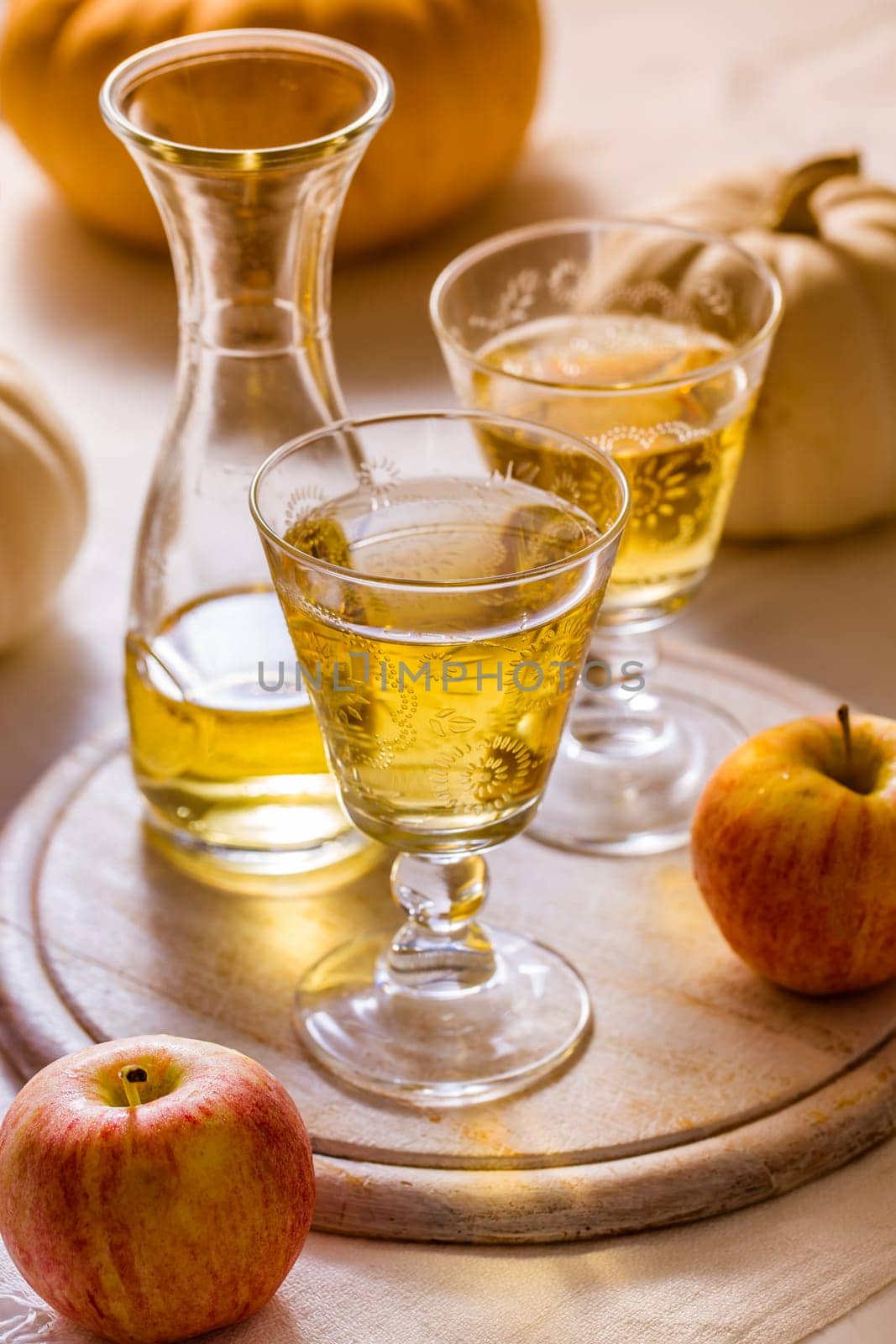 Apple cider with fresh apples and pumpkins for Thanksgiving and autumn