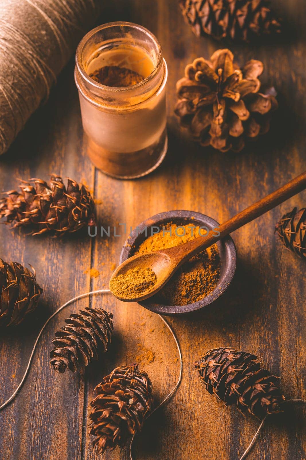 Gingerbread spice mix and seasoning for gingerbread cookies for Christmas on wooden background