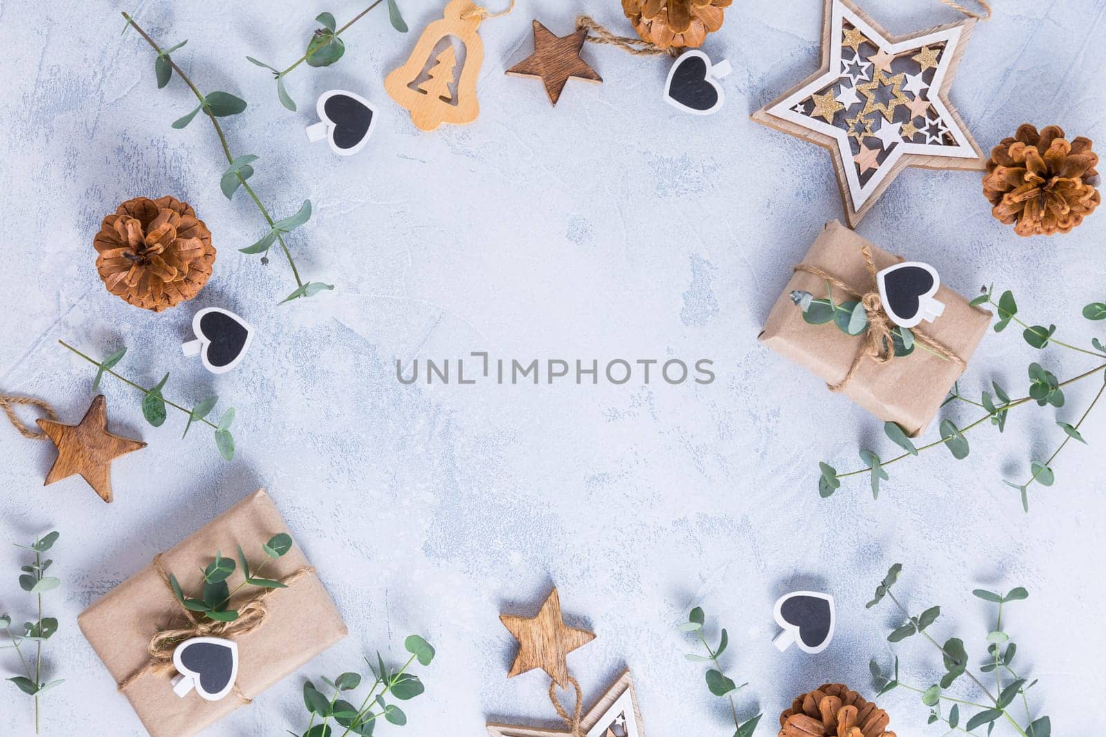 Holiday Christmas Gifts with Boxes, Coniferous, eucalyptus and ornaments on snowy background