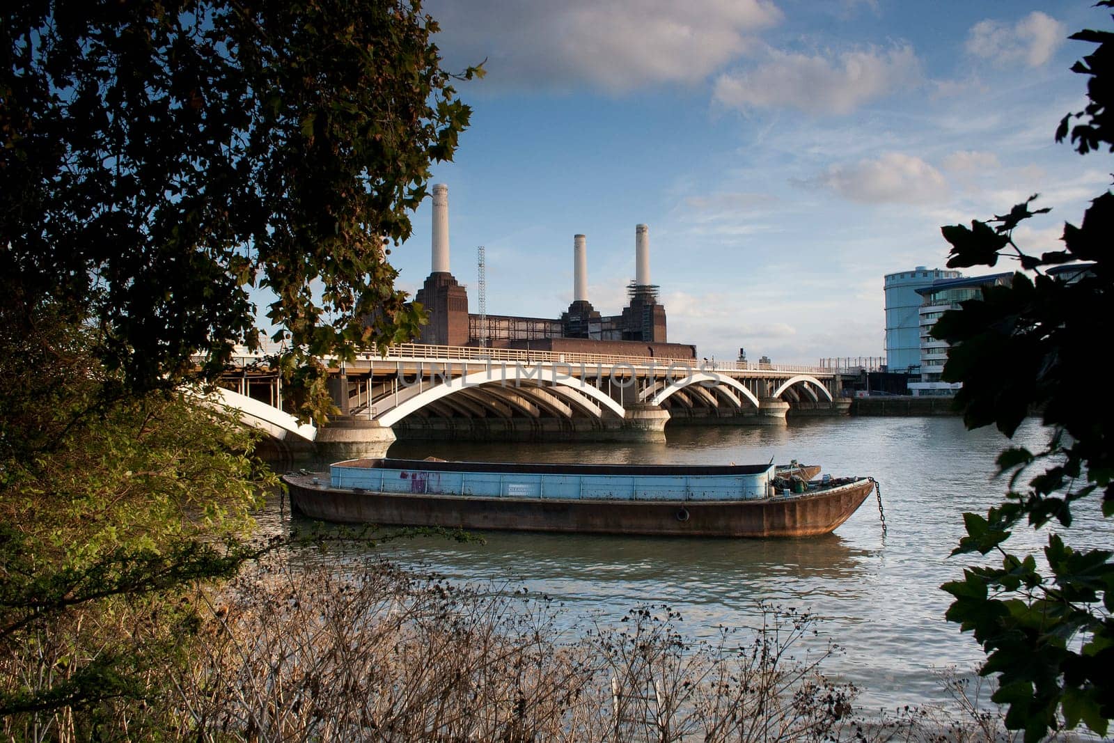 A Thames river barge Grosvenor Rail Bridge Battersea Power Station