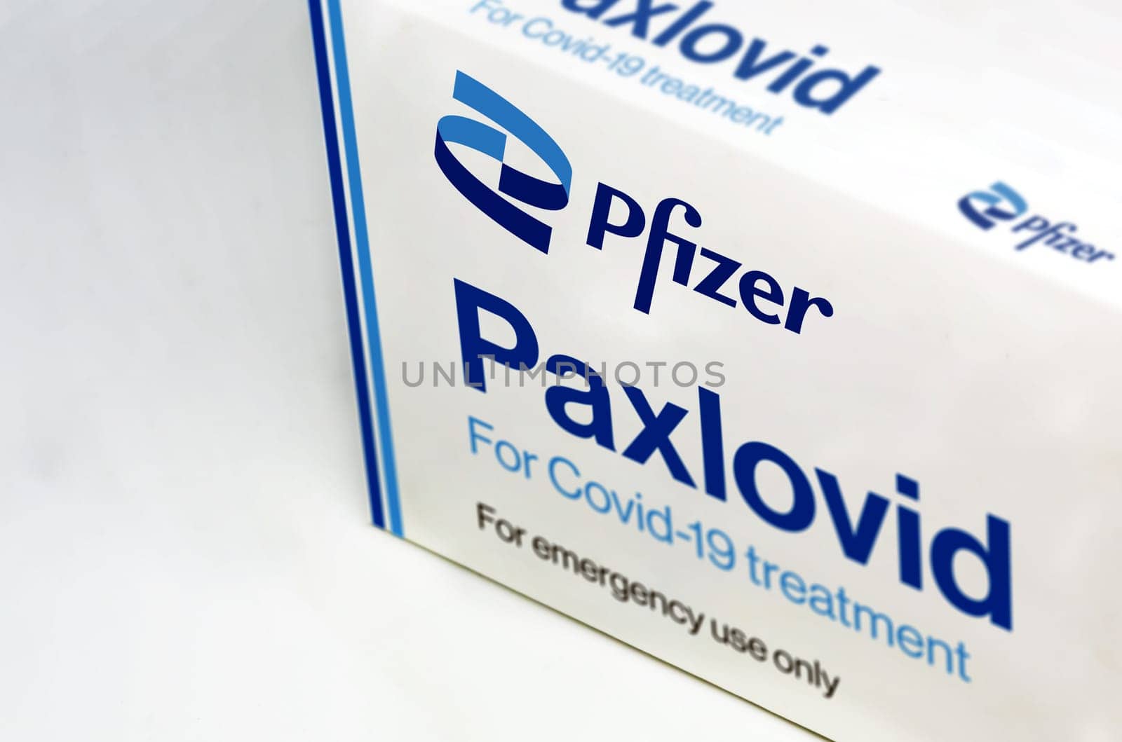 New York, USA, November 2021: Pfizer Covid-19 Paxlovid treatment box isolated on a white background. Health and prevention.