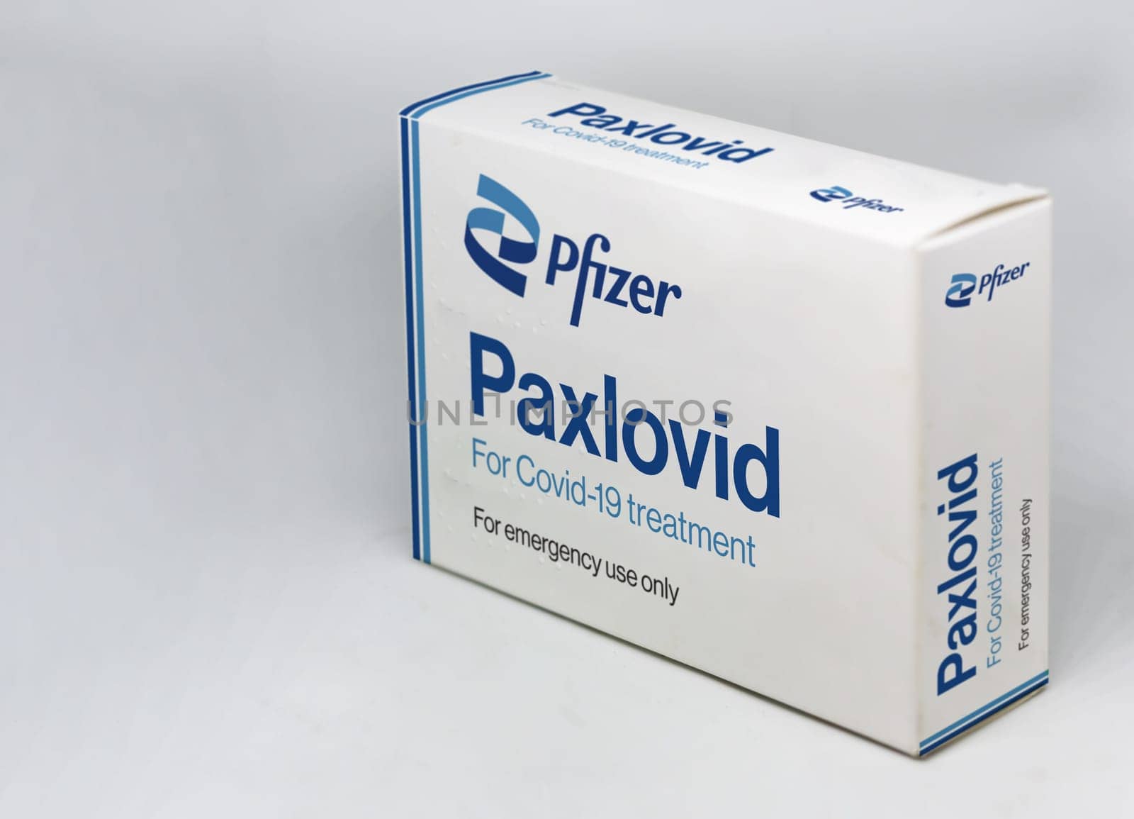 New York, USA, November 2021: Pfizer Covid-19 Paxlovid treatment box isolated on a white background. Health and prevention.