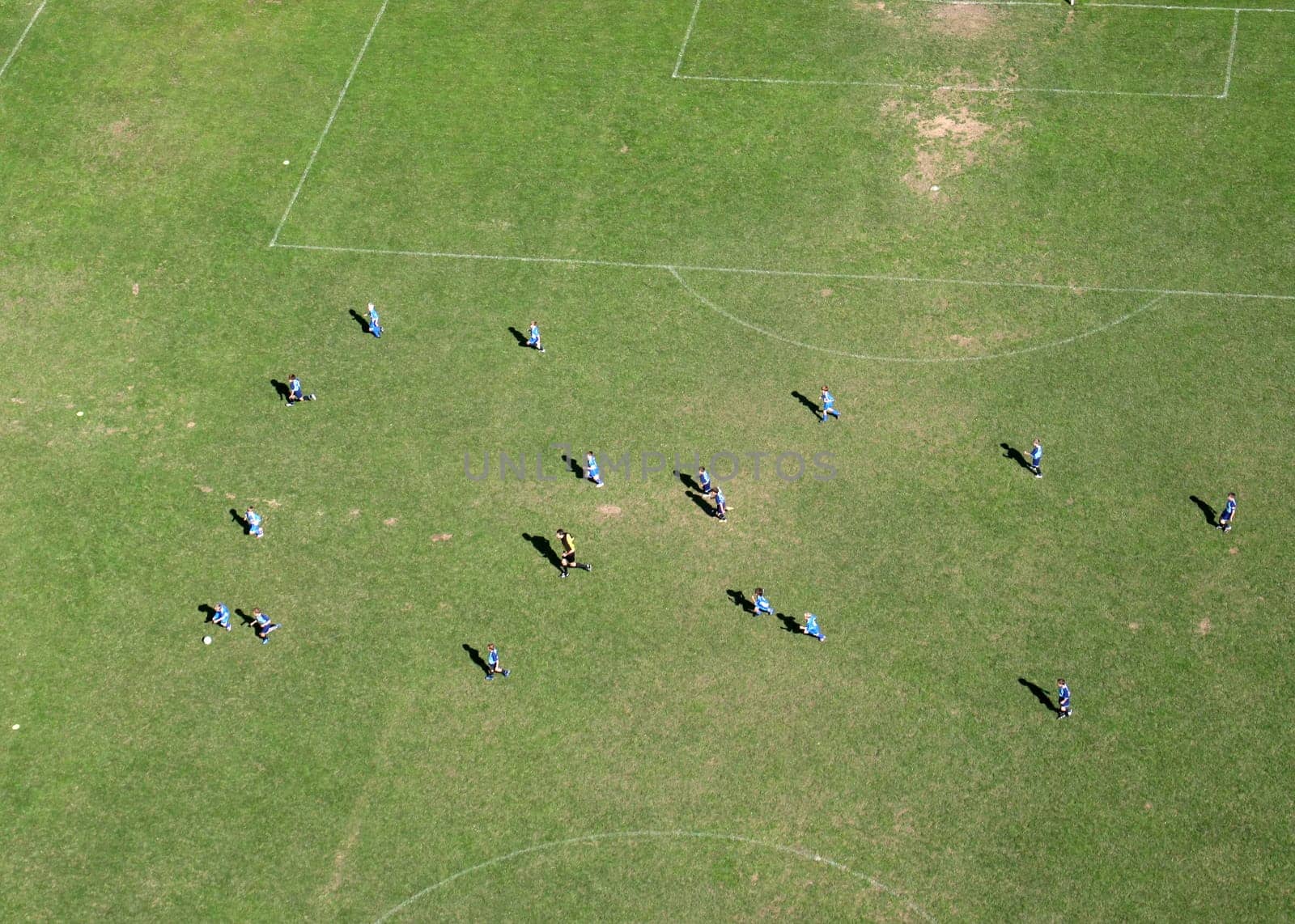Children train football on a large football field in Velika Gorica, Croatia