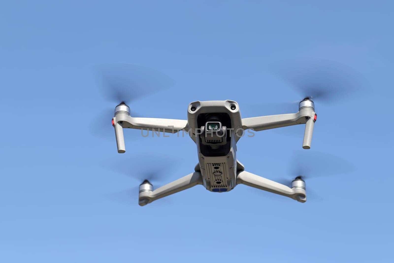 drone flying in air and clear blue sky background
