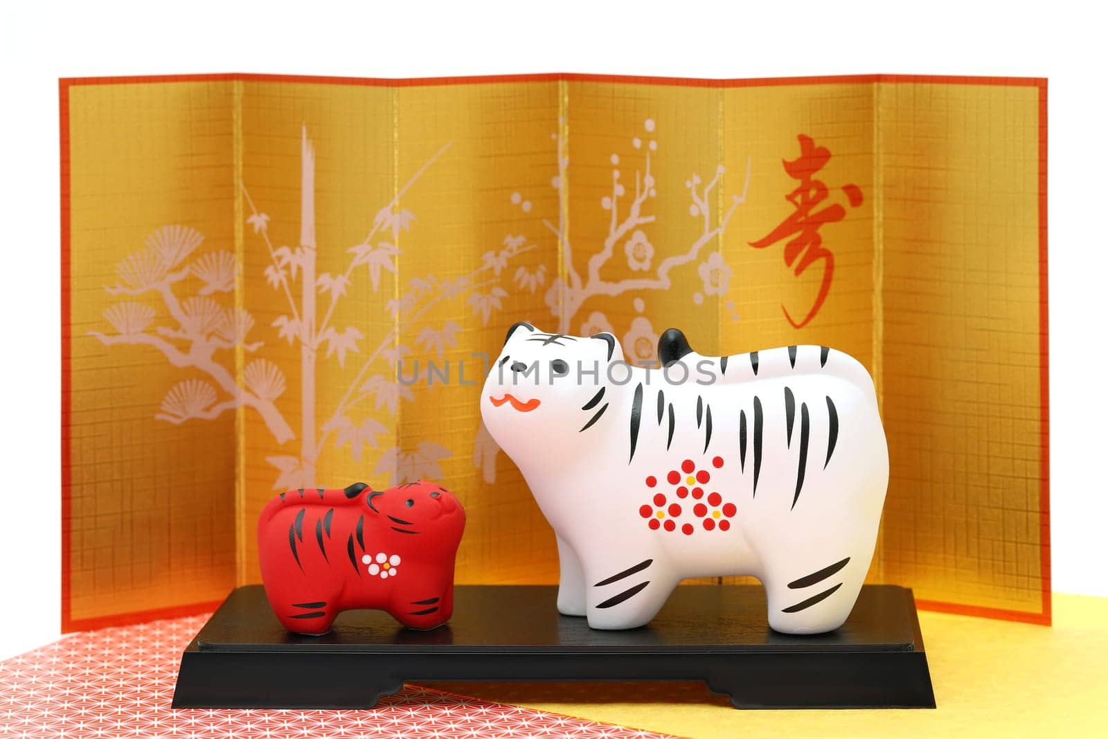 Dolls of Tora Tiger. Japanese new year card. Japanese new year tiger object. Japanese word of this photography means "congraturations"""