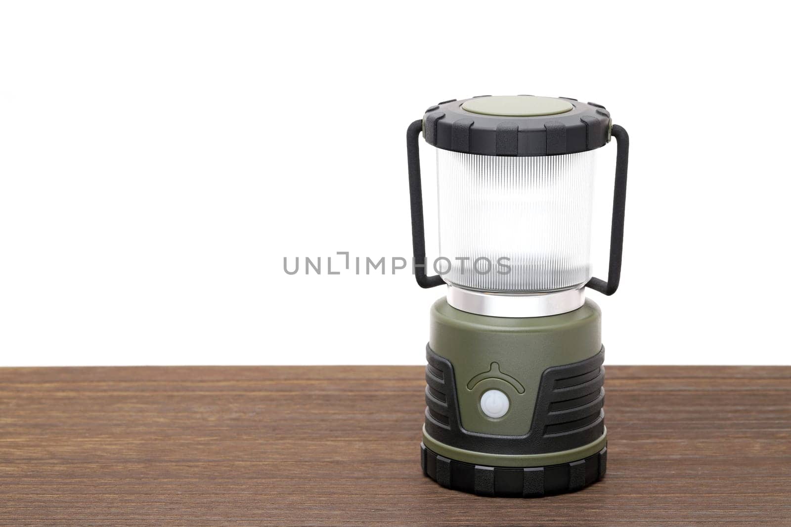 Photo of a led lantern for camping on a wooden table