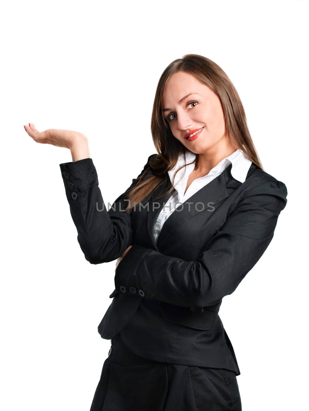 Smiling business woman showing something. Isolated over white.