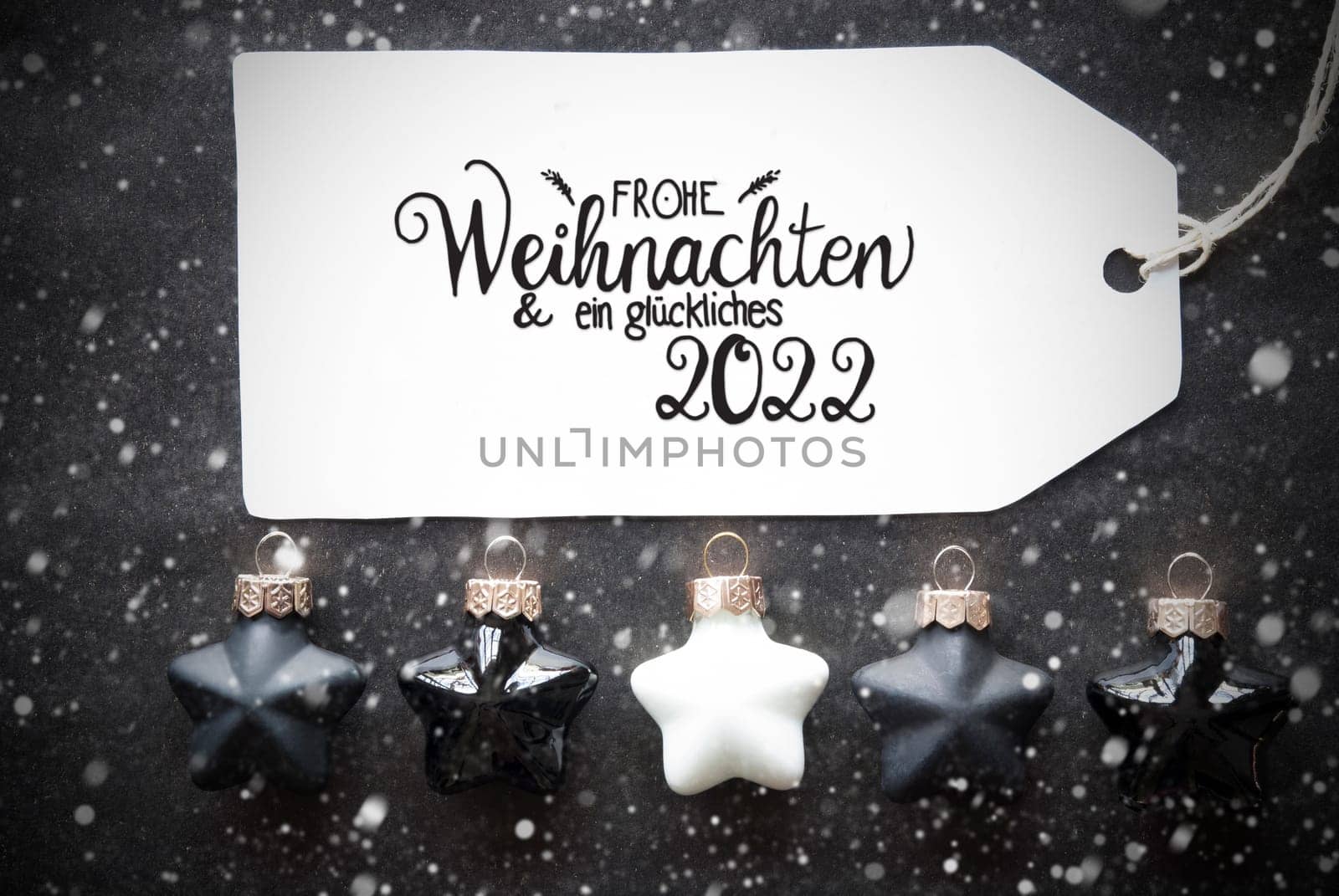 Label With German Calligraphy Frohe Weihnachten Und Ein Glueckliches 2022 Means Merry Christmas And A Happy 2022. Black Christmas Ball Ornament With Snowflakes