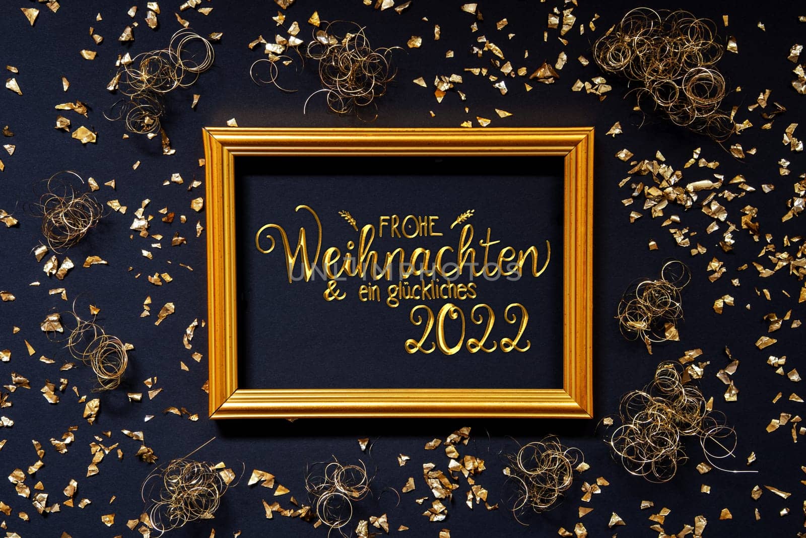 Frame With German Text Frohe Weihnachten Und Ein Glueckliches 2022 Means Merry Christmas And A Happy 2022. Golden Christmas Decoration And Ornament. Black Background With Glitter And Sparkle