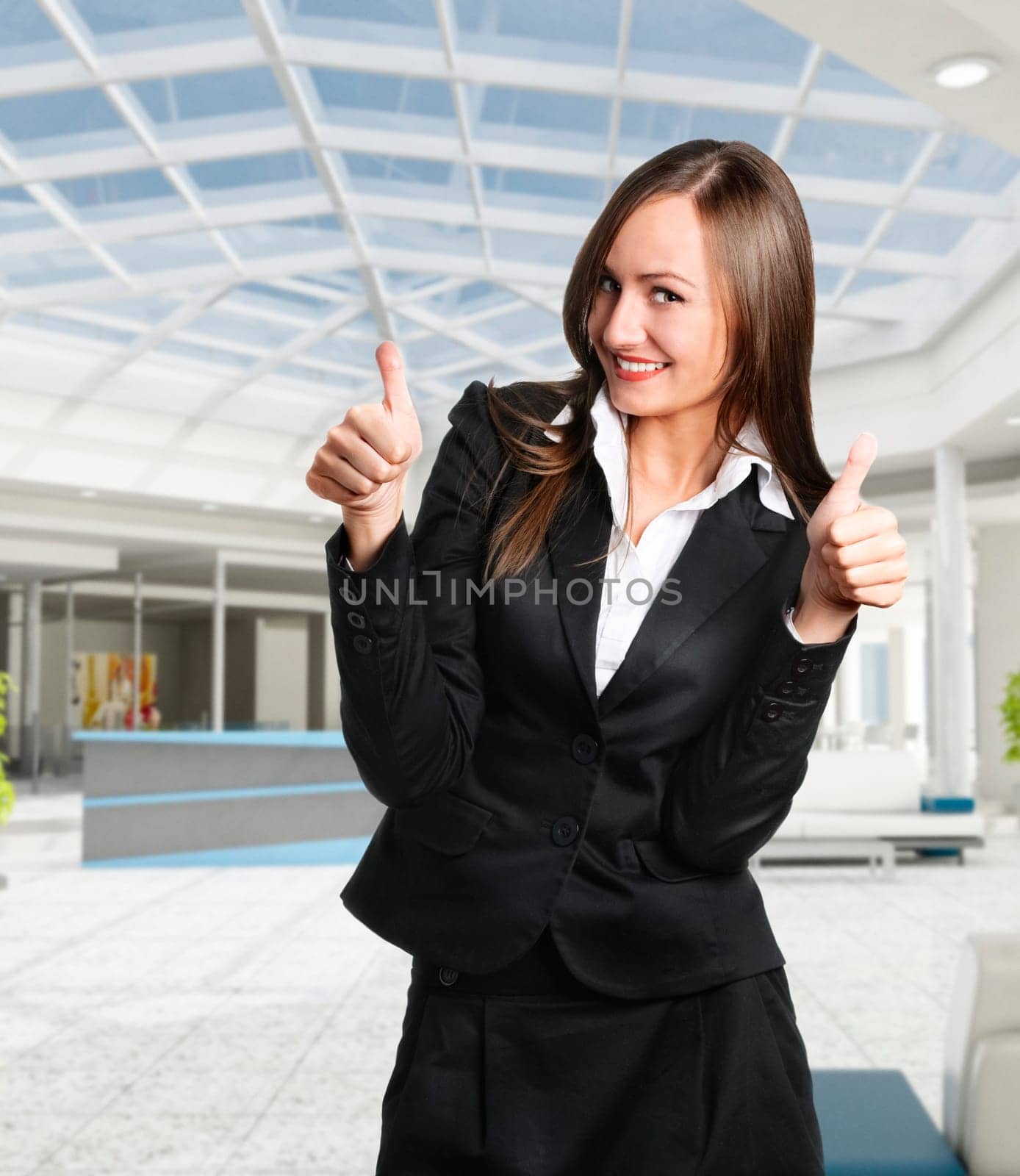 Smiling business woman in corporate building