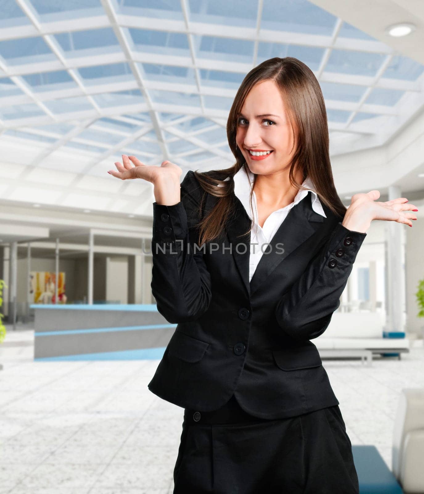 Smiling business woman in corporate building