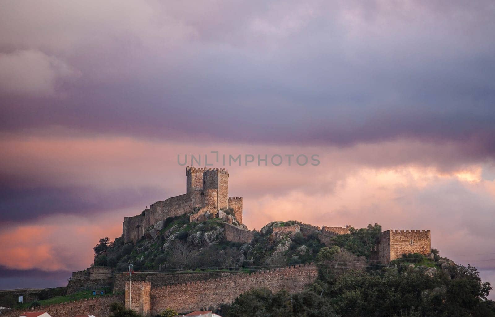 Luna Castle on winter season. Taken a purple sunset cloudy day. Alburquerque, Extremadura, Spain