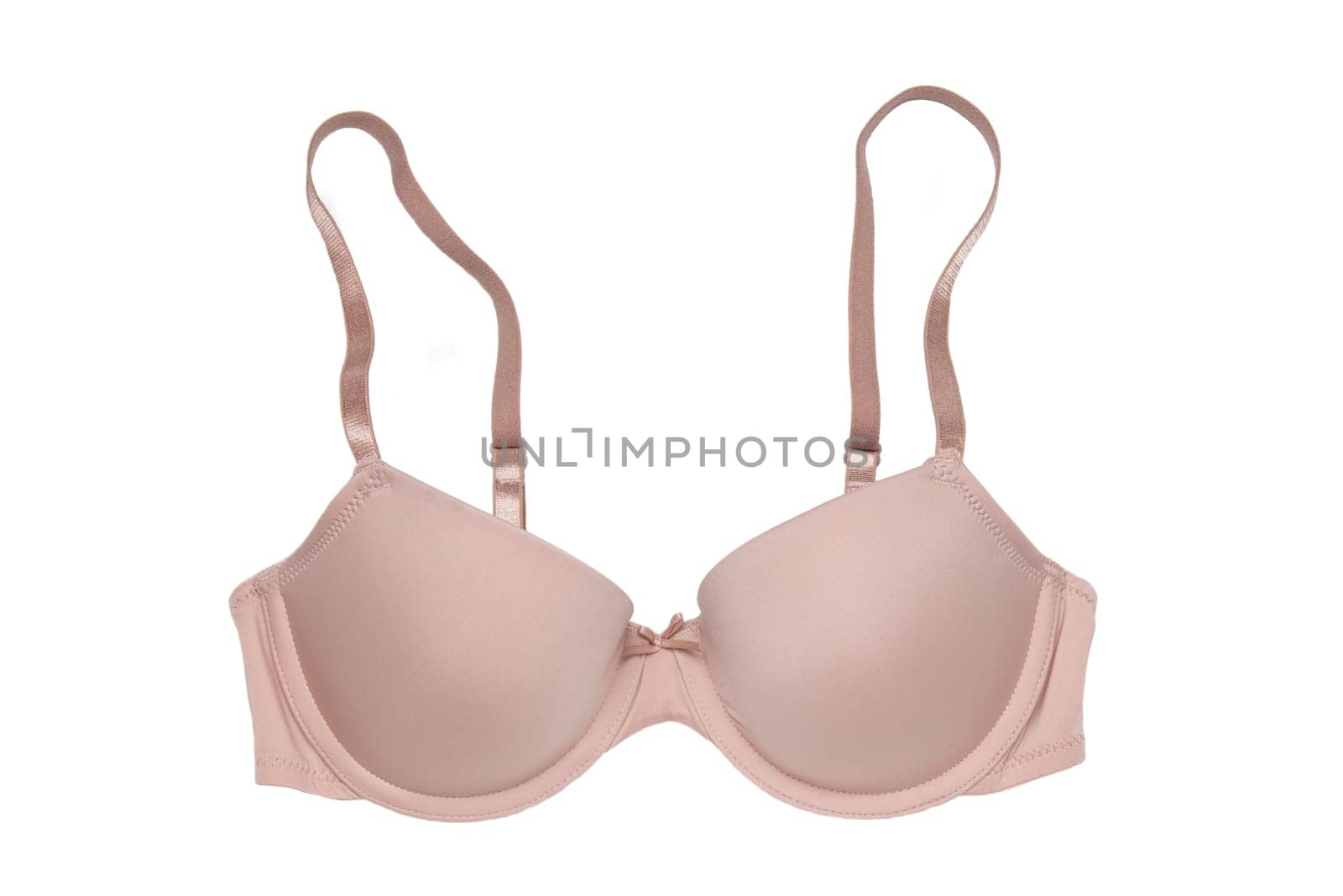 Bra isolated. Closeup of beautiful female stylish flesh colored brassiere with straps isolated on a white background. Fashionable sexy women underwear.