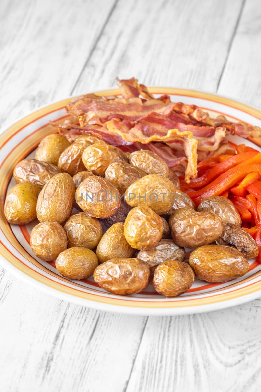 Golden potatoes, smoky bacon, and roasted peppers create a savory, flavorful dish