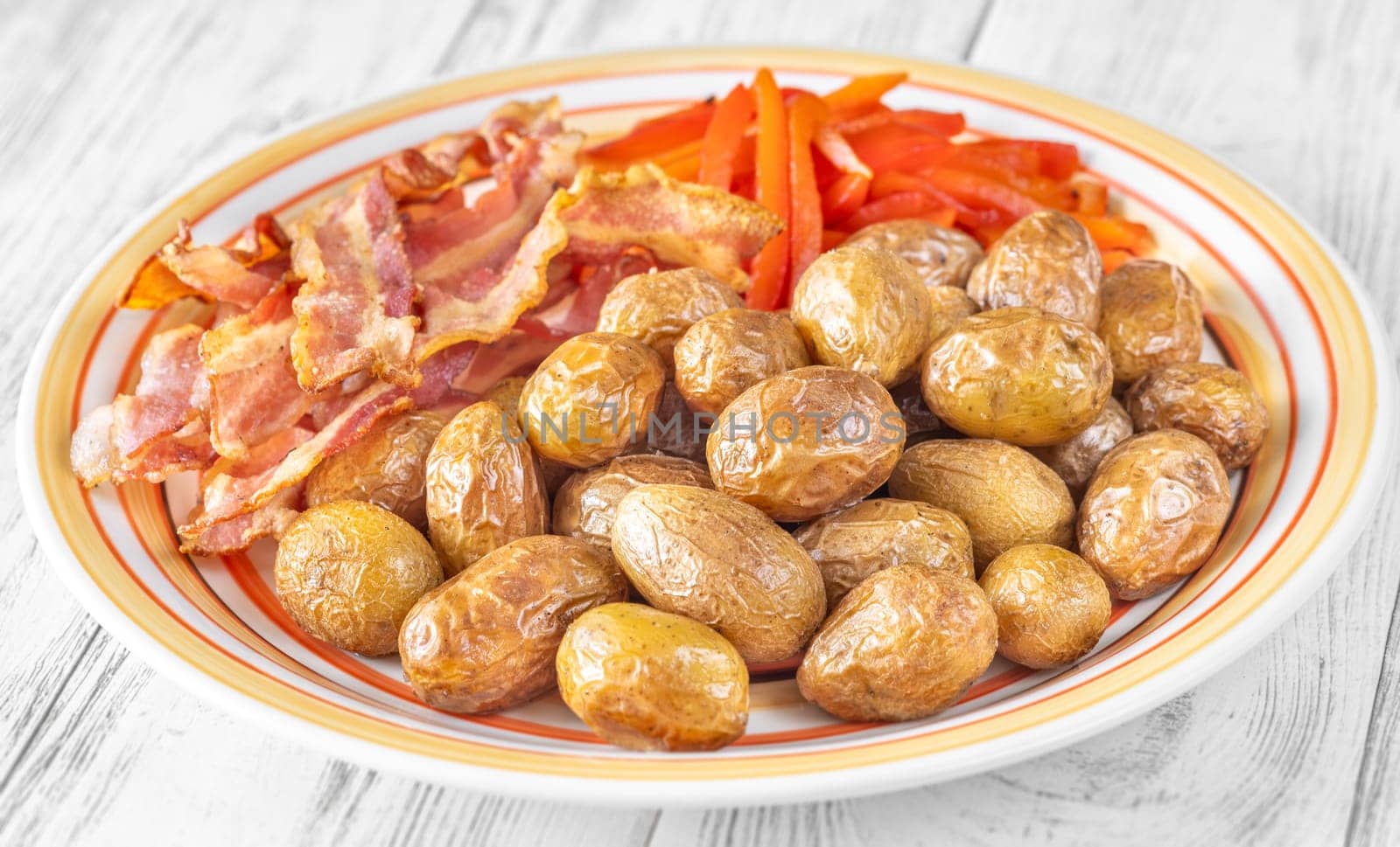 Golden potatoes, smoky bacon, and roasted peppers create a savory, flavorful dish