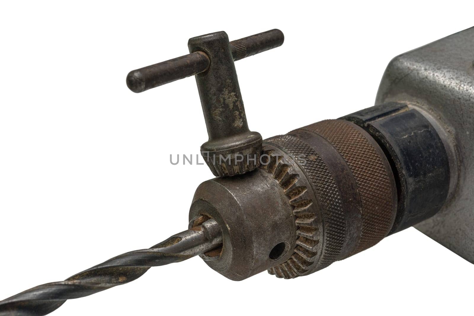Electric drill head with drill and drill key, isolated