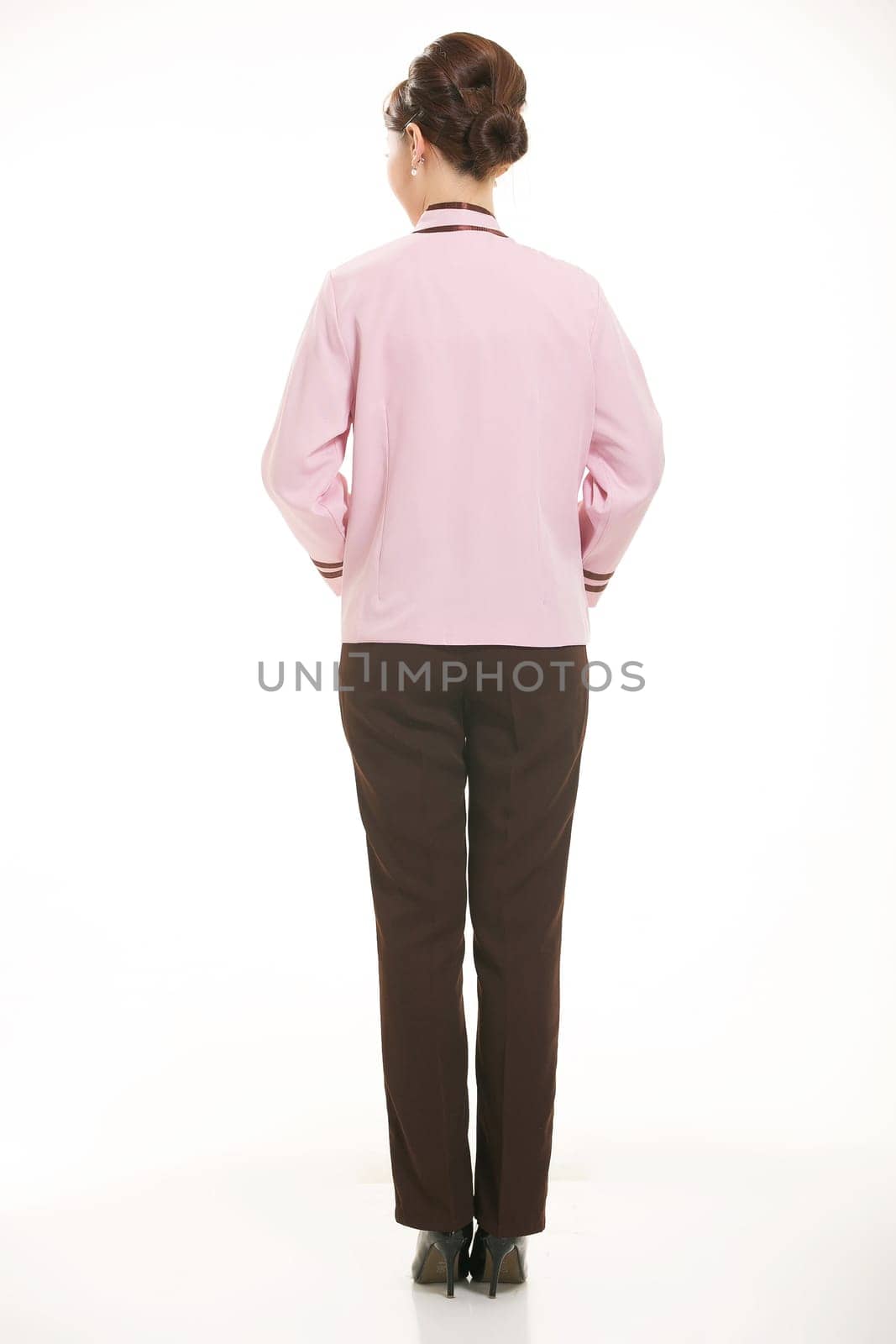 In a variety of occupation clothing cleaners stand in front of a white background