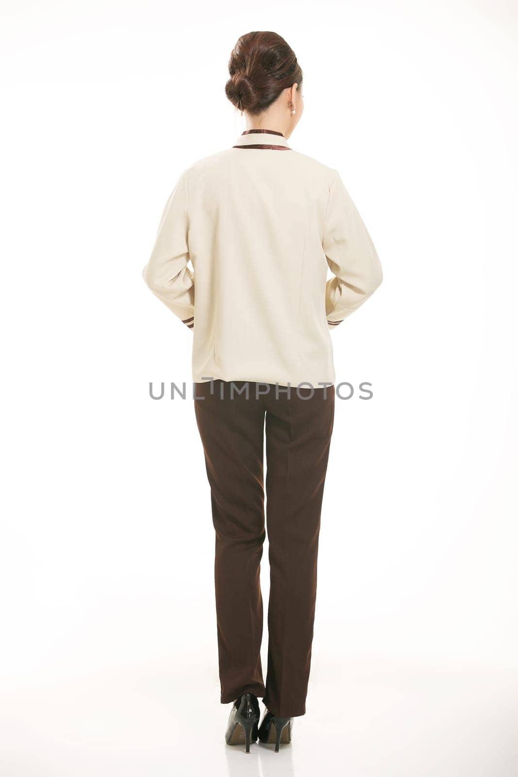 In a variety of occupation clothing cleaners stand in front of a white background