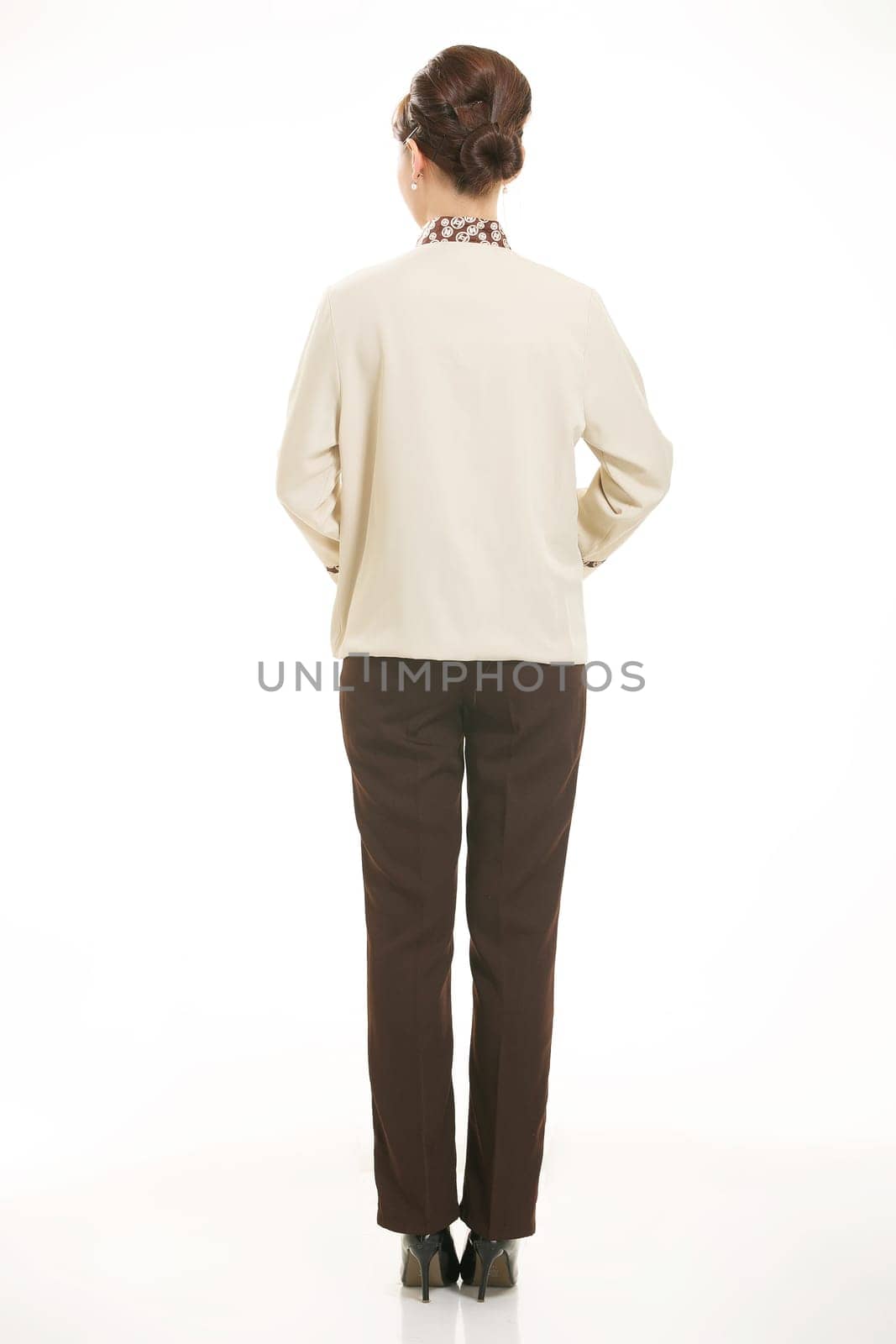 In a variety of occupation clothing cleaners stand in front of a white background