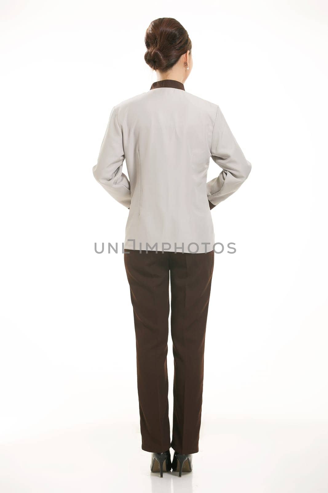 In a variety of occupation clothing cleaners stand in front of a white background