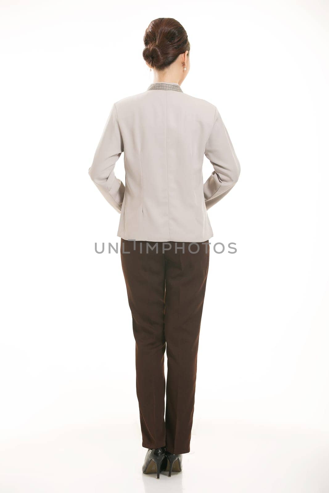 In a variety of occupation clothing cleaners stand in front of a white background