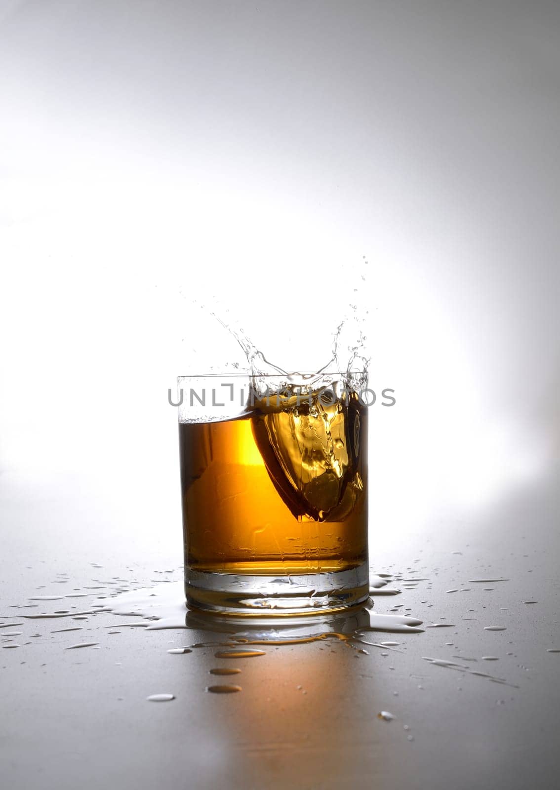 Splashing glass of whiskey