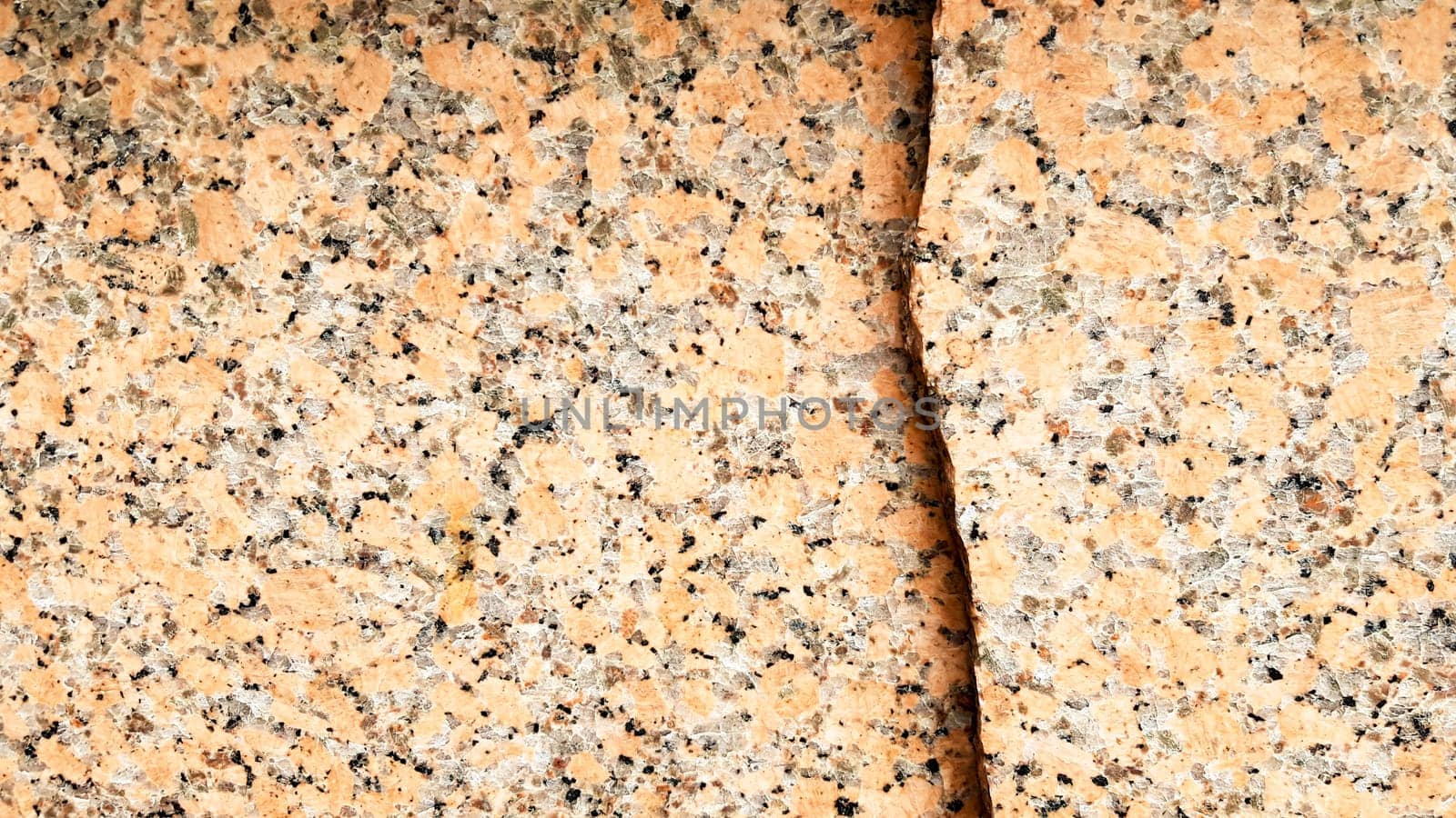 Real natural brown granite pattern, polished mineral slice. Seamless cracked marble damaged concrete texture. Architectural background. Brown spots on a stone background. marbling.
