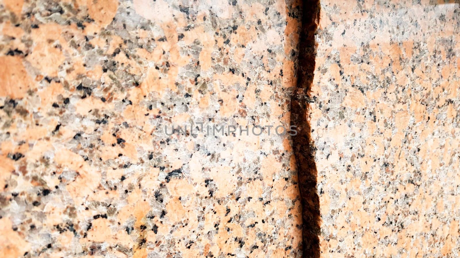 Real natural brown granite pattern, polished mineral slice. Seamless cracked marble damaged concrete texture. Architectural background. Brown spots on a stone background. marbling.