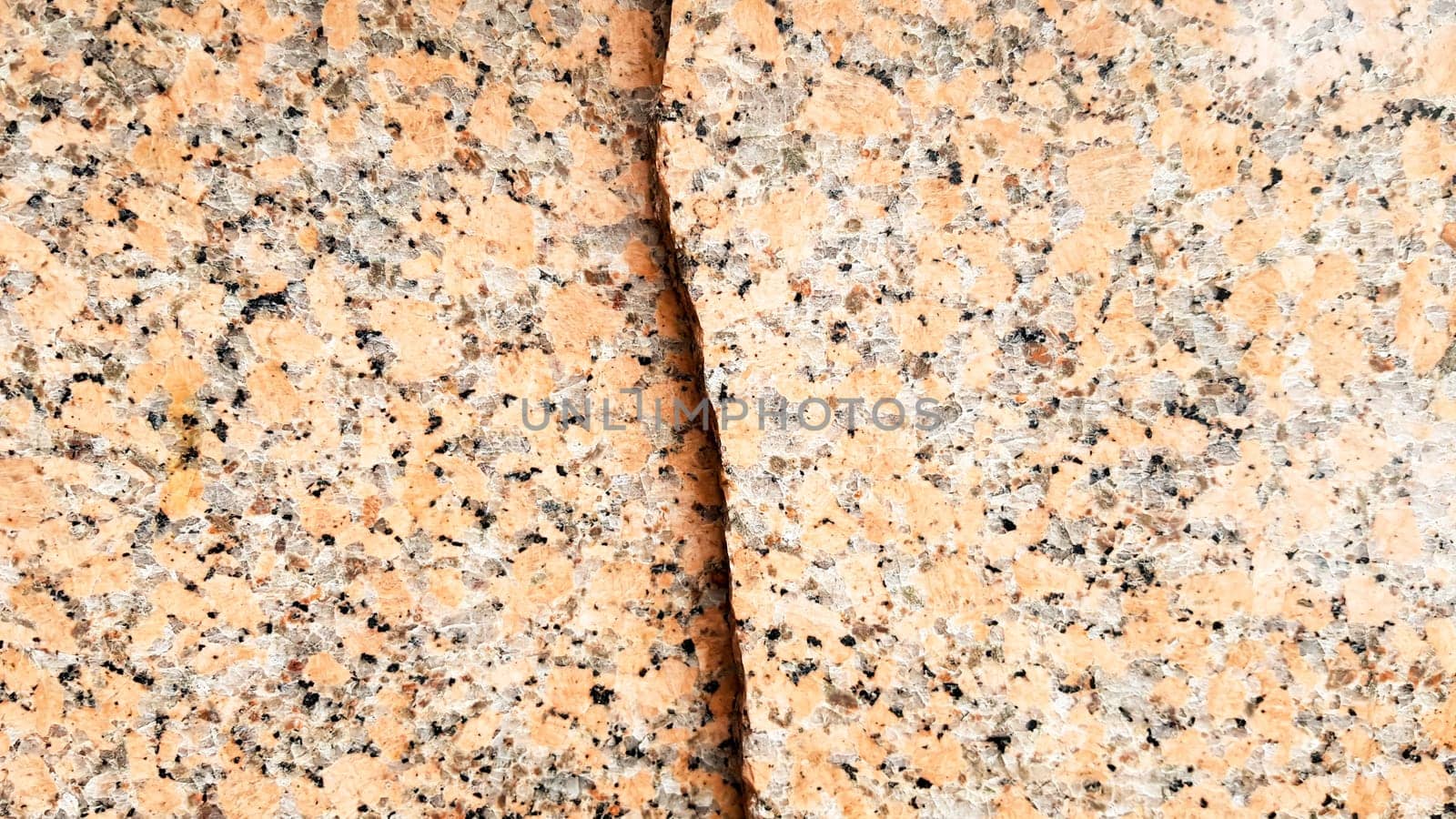 Real natural brown granite pattern, polished mineral slice. Seamless cracked marble damaged concrete texture. Architectural background. Brown spots on a stone background. marbling.
