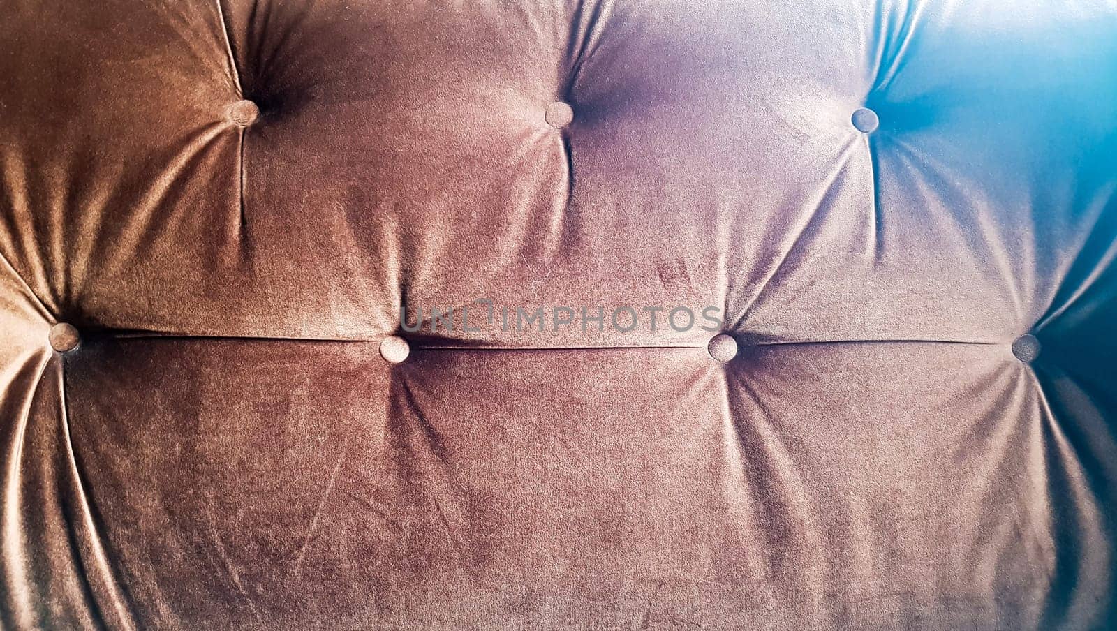 Brown capitone texture background, Chesterfield retro style diamond-shaped soft tufted fabric decoration with buttons, decorate with buttons, close up