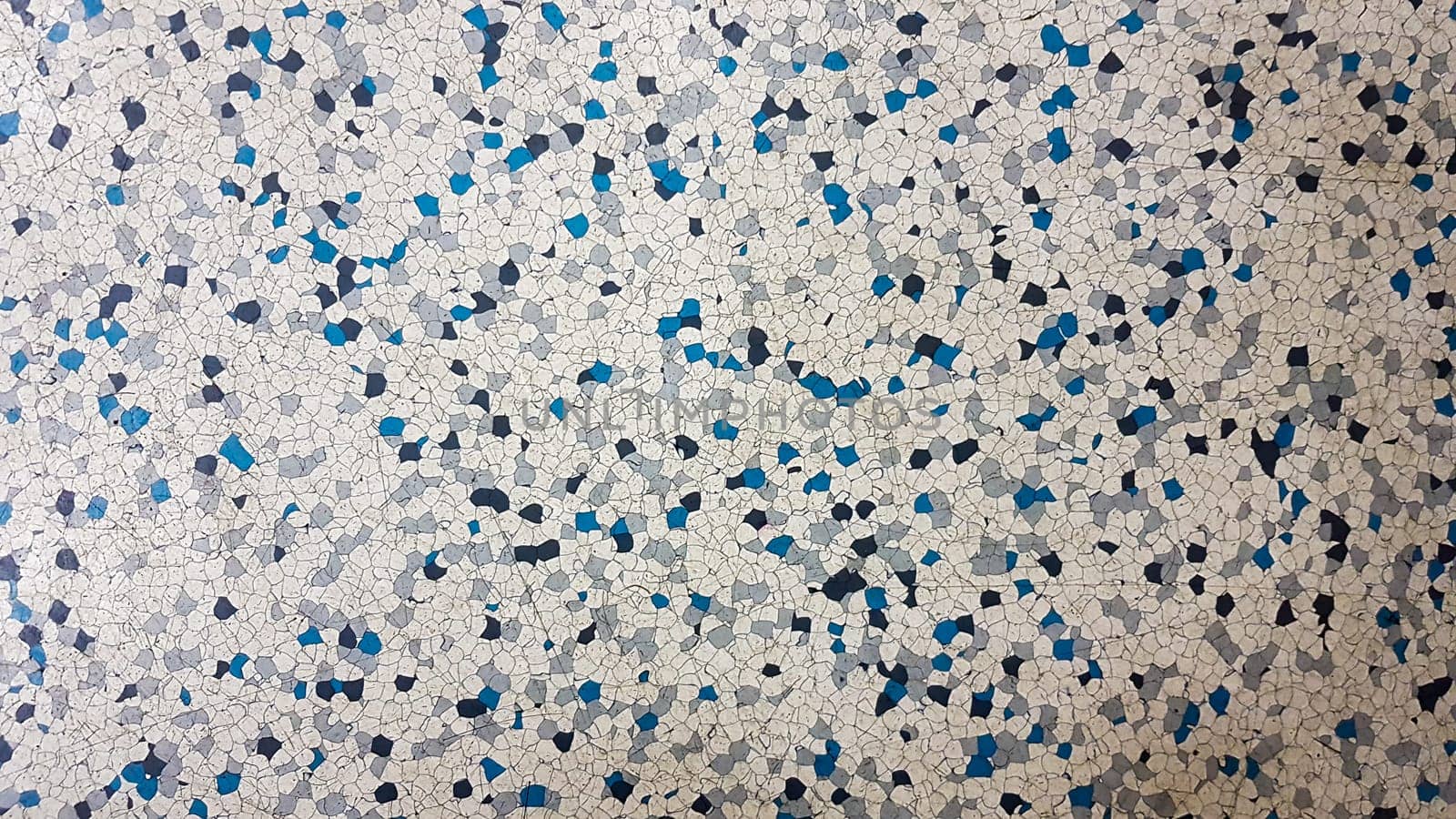 Floor covering with rubber granules. Special rubber coating for the playground. Multi colored rubber crumb closeup background