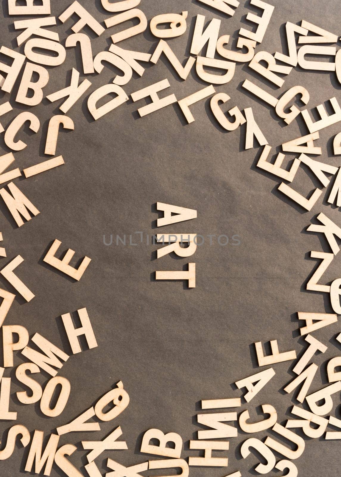 Art Word In Wooden Cube Alphabet Letters Top View On A rustic paper Background.