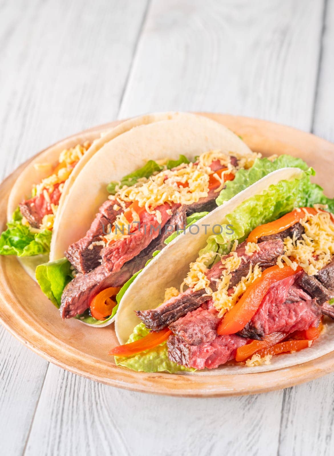  Flavorful carne asada tacos with tender steak, fresh toppings, and melted cheese