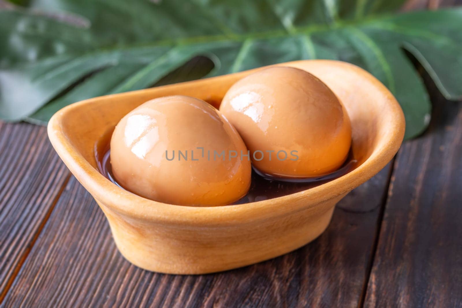 Soft-boiled ramen eggs soaked in savory marinade, garnished with sesame seeds