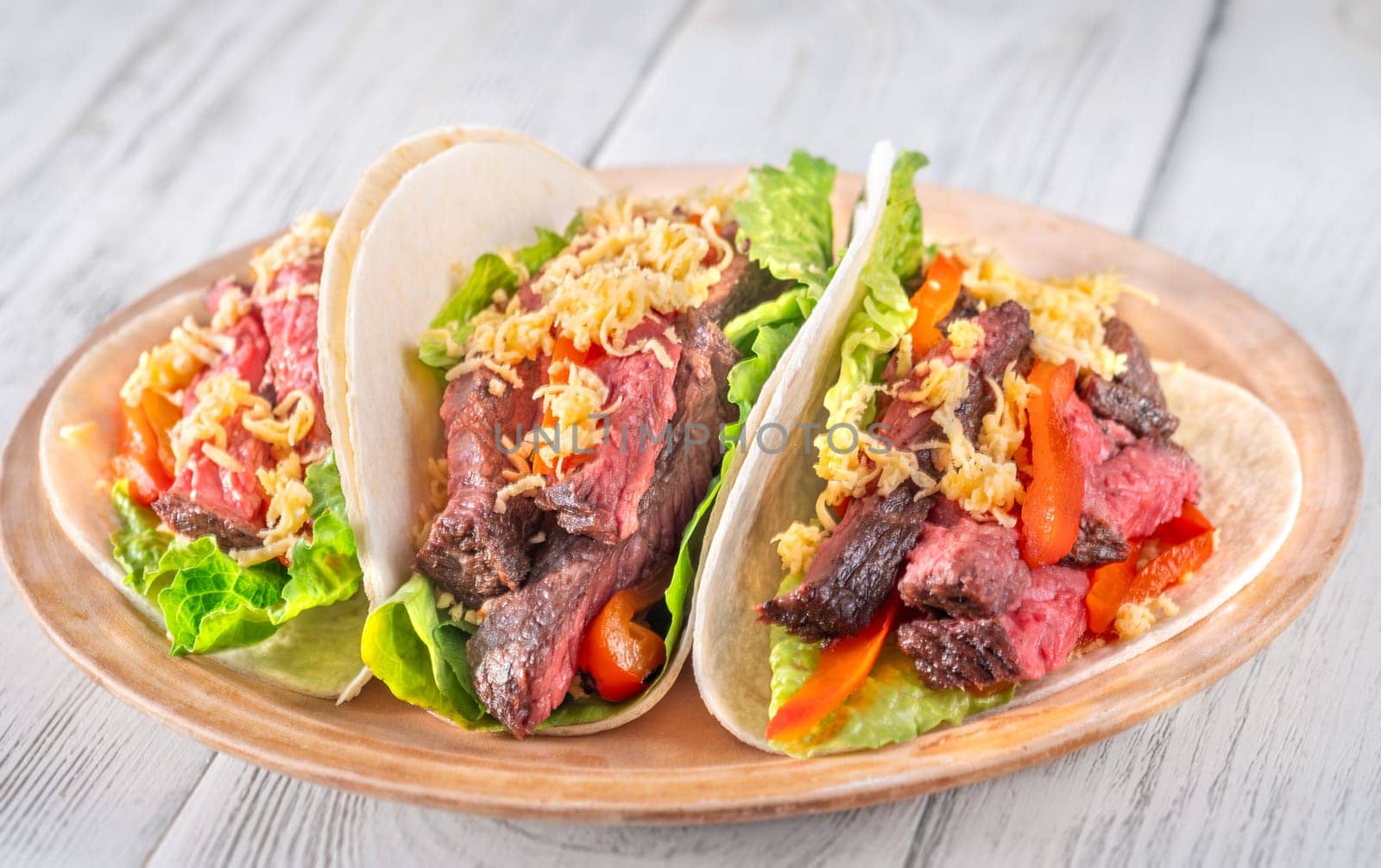  Flavorful carne asada tacos with tender steak, fresh toppings, and melted cheese