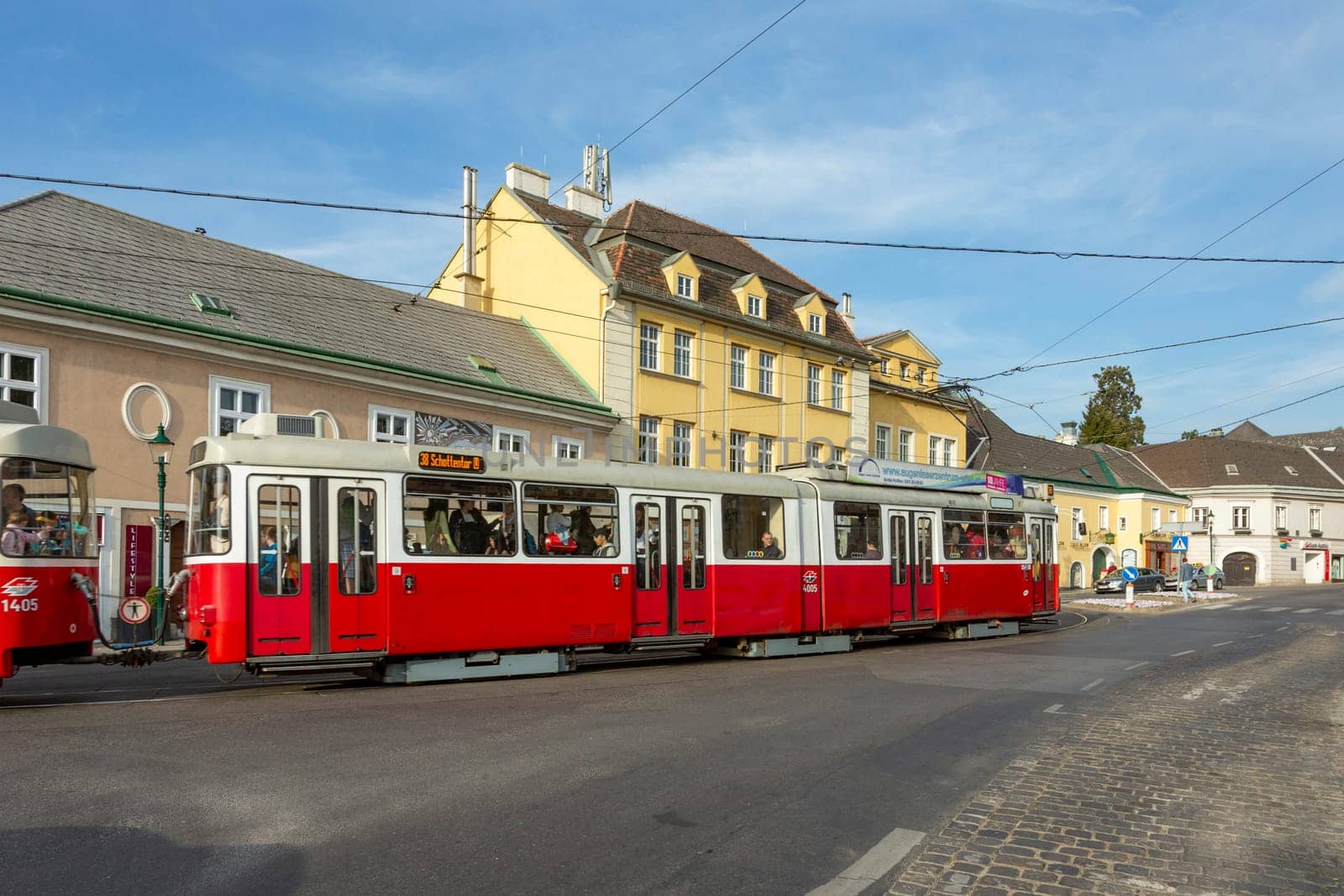 Vienna, Austria - April 27, 2015:  view to center of Grinzing in Vienna in early morning with nearly empty streets and streetcar.