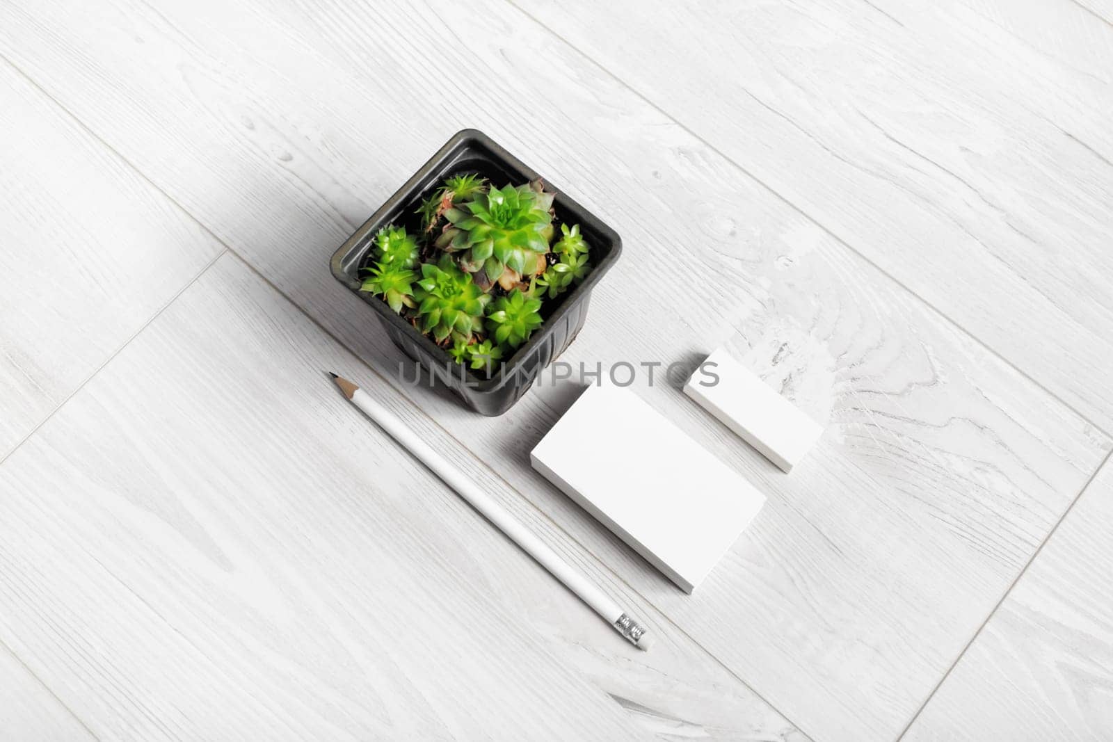 Brand identity mockup. Blank corporate stationery set on light wooden background.