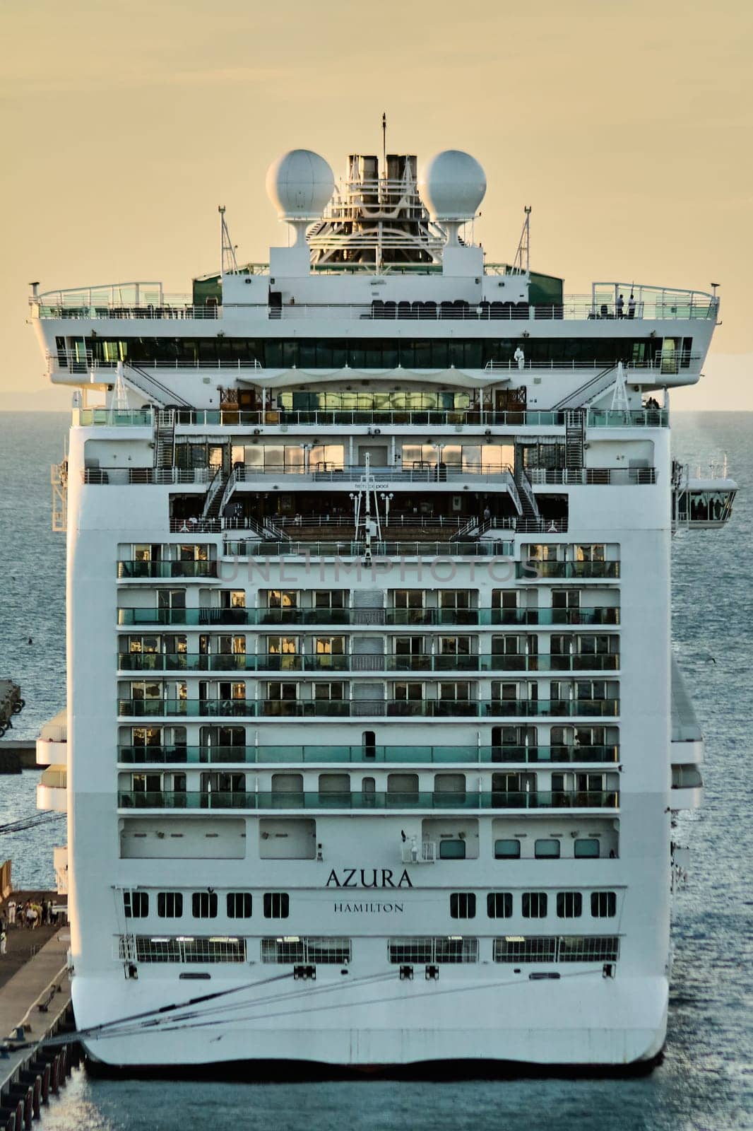 Civitavecchia, Italy - February 6, 2025: Close-up of the upper decks of a cruise ship highlighting the ship's architecture and serene sea view. Perfect for travel and maritime concepts.