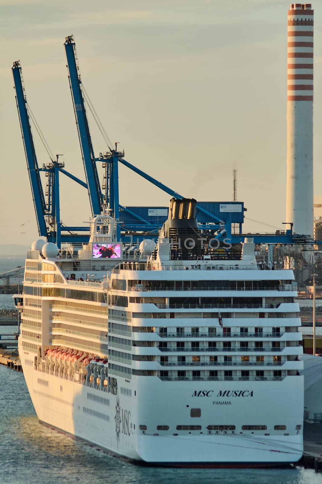 Civitavecchia, Italy - February 6, 2025: View of a cruise ship in Civitavecchia, Italy, with decks and amenities visible in front of a calm sea. Suitable for travel, tourism and maritime industries.