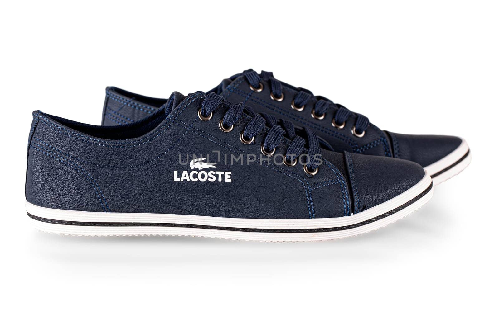 Kamchatka, Russia - 22 Octember , 2021: Lacoste blue comfortable shoes for man isolated on white background.