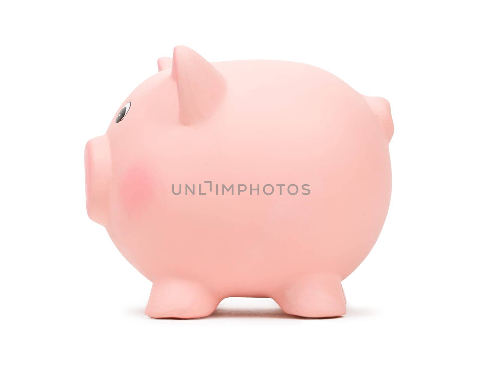 Pink ceramic piggy bank, side view, isolated on white background