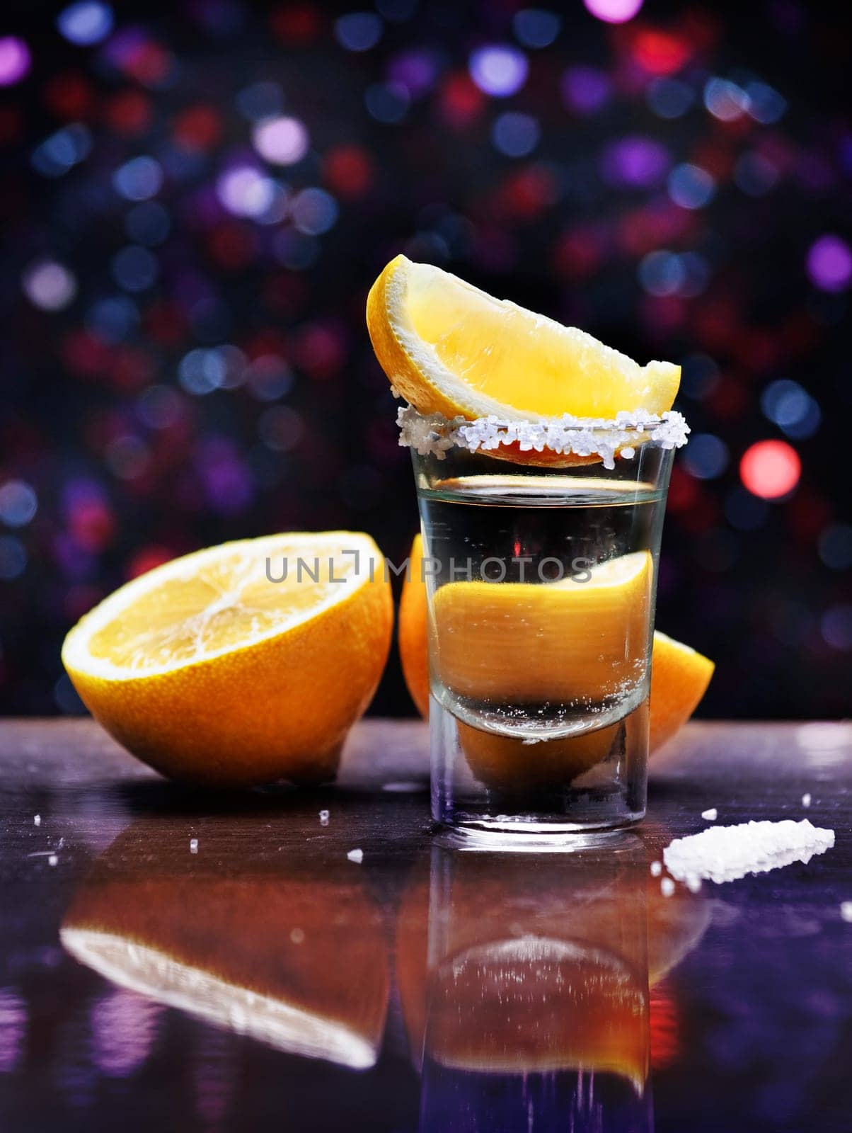 Tequila shot with lemon slice and salt