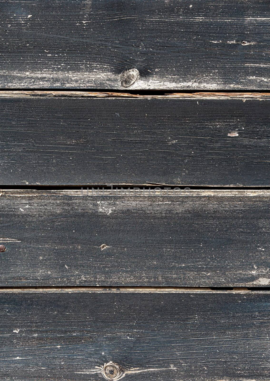 The old black wooden boards as background. Selective focus