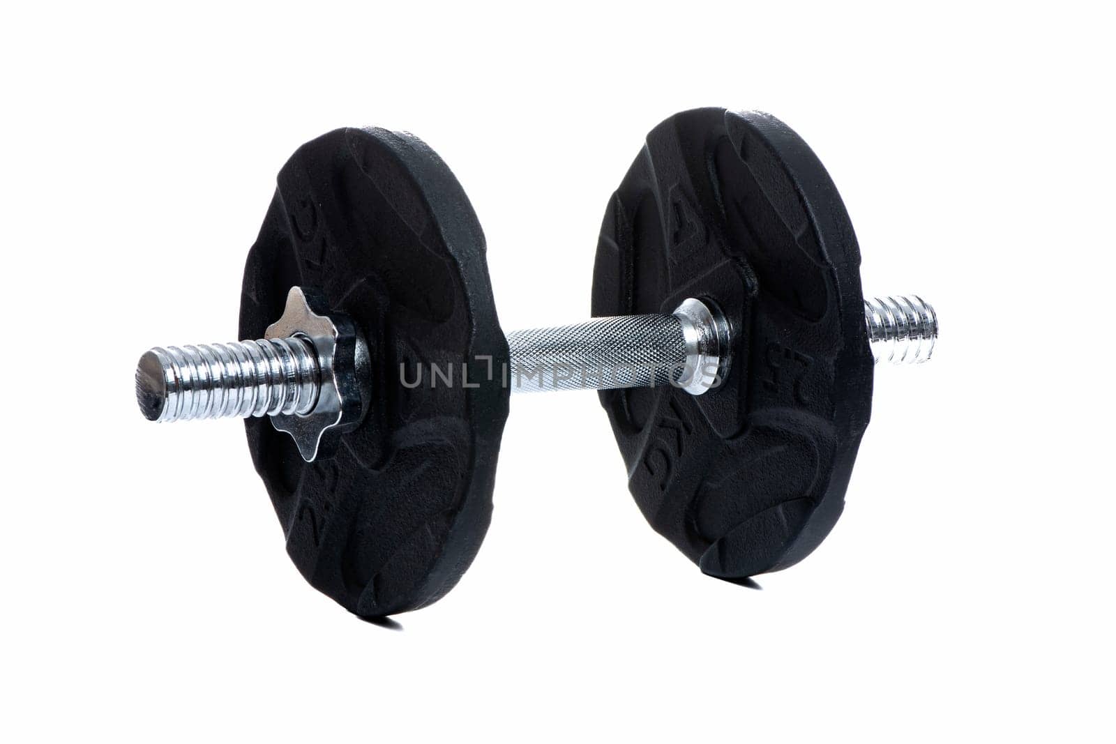 Metal dumbbell with black pancakes and chrome fingerboard on a white insulated background. High quality photo