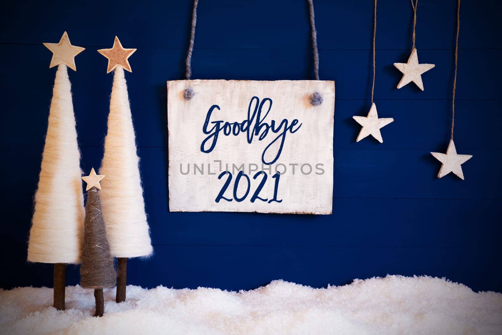 Christmas Decoration Like White Tree With Star On Blue Background. White Snow On Ground. Sign With English Calligraphy Goodbye 2021