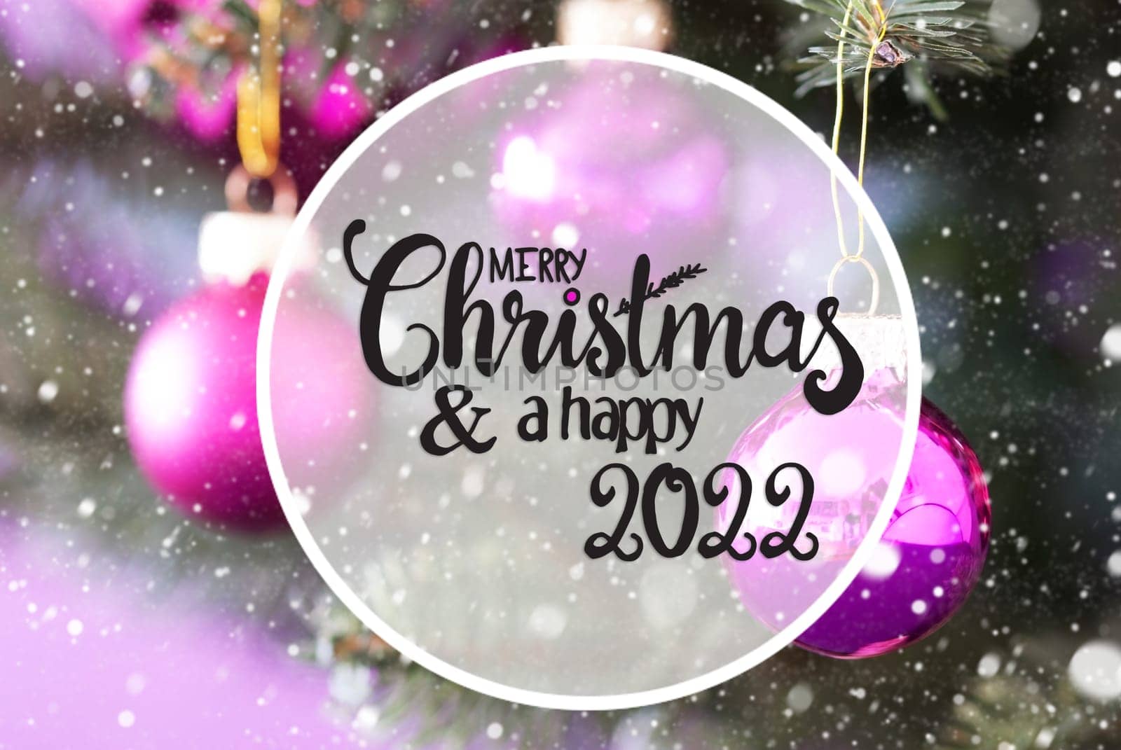 English Calligraphy Merry Christmas And Happy 2022. Blurry Christmas Tree With Pink Christmas Ball Ornament And Snowflakes
