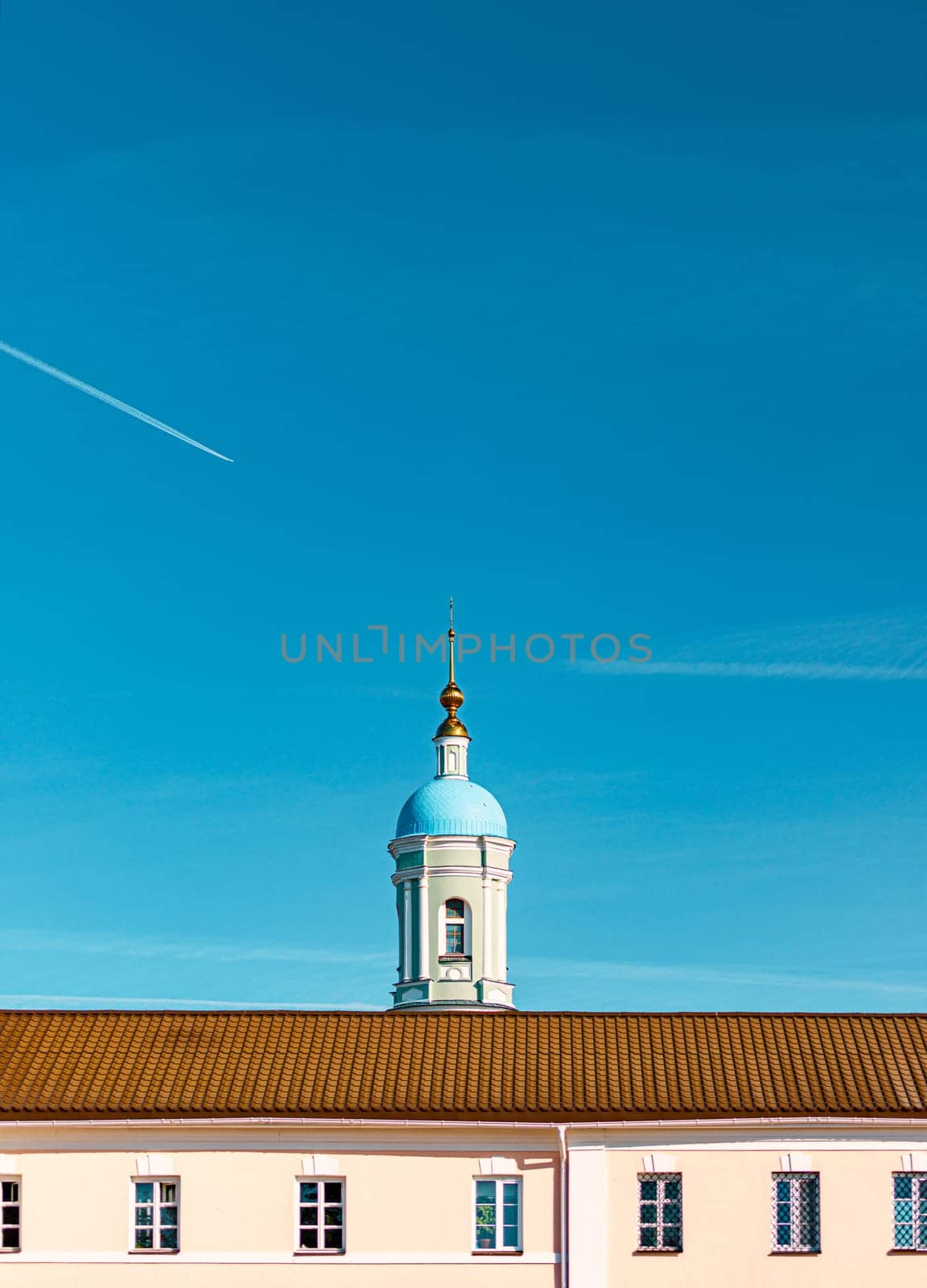 Old russian church with blue sky in background